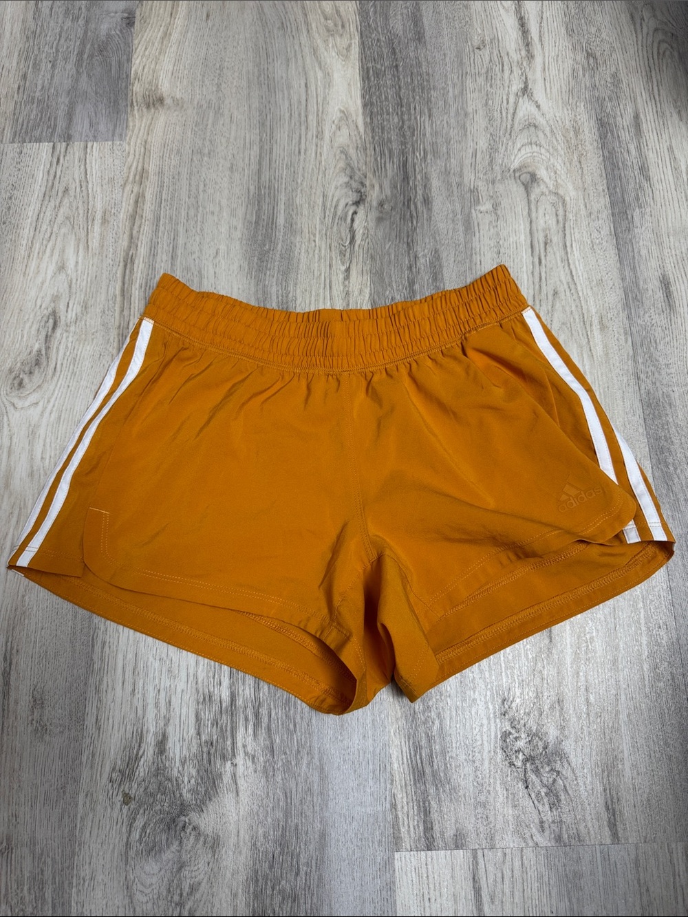 Brand new ! adidas Women's Rust Orange Athletic Shorts with White Side Stripes